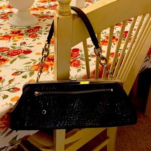 Apostrophe faux croc clutch.never used.
